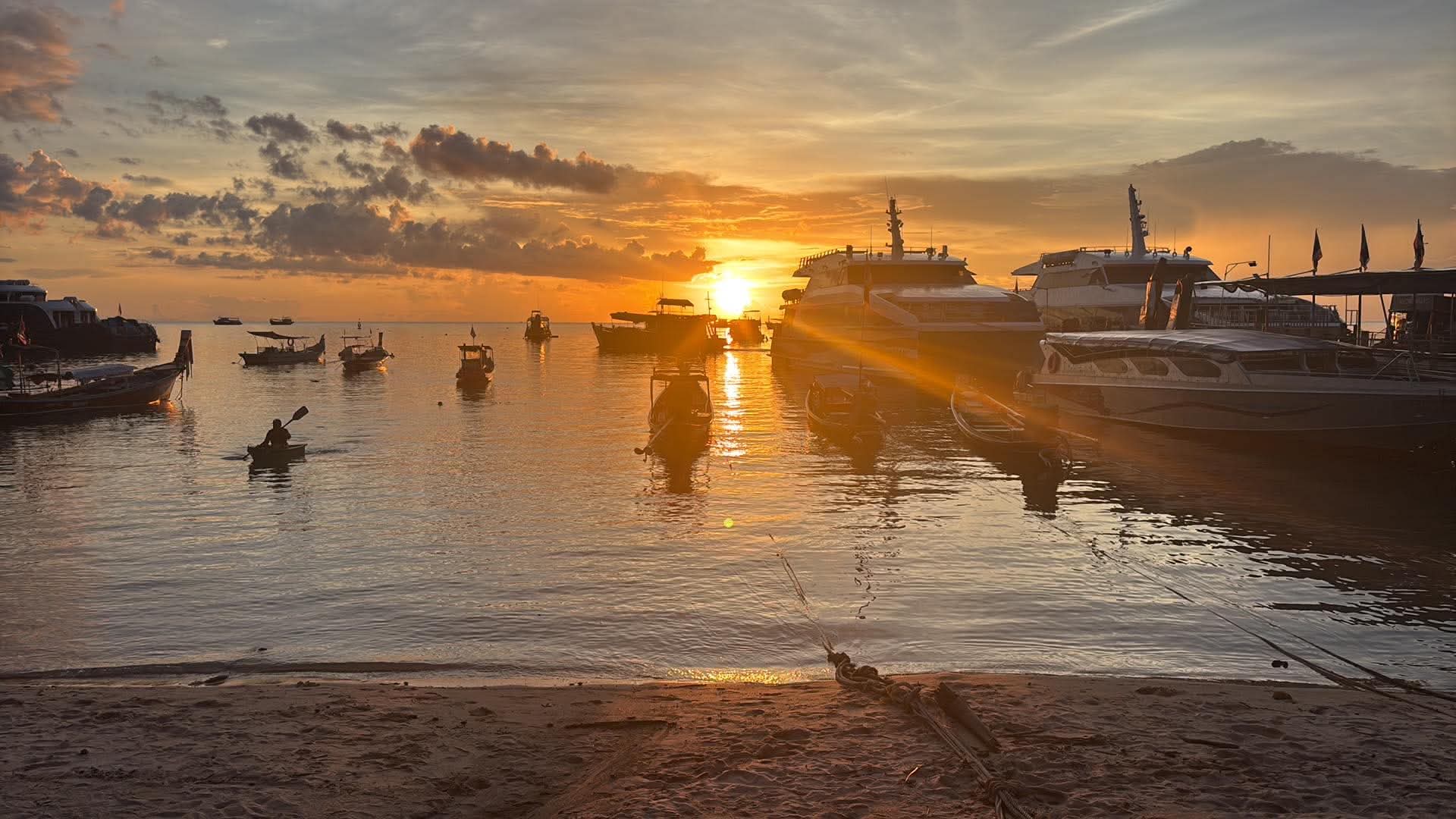 WaterMellow Hostel beachfront view with ocean sunset